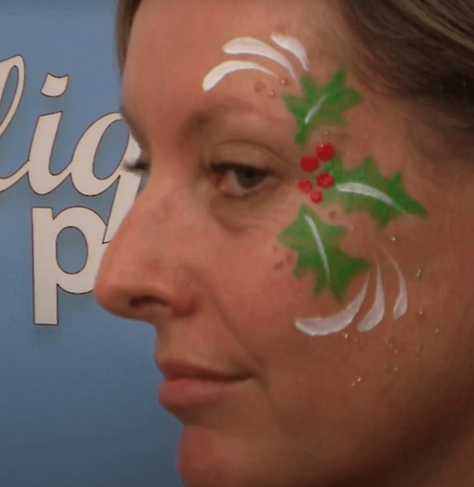 Christmas Holly eye design  Christmas face painting, Girl face painting, Face  painting